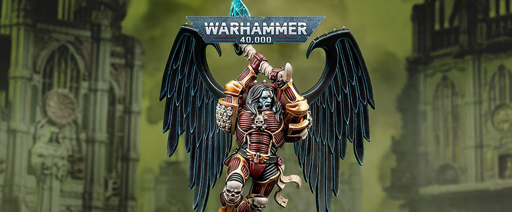 Warhammer 40,000 figurine with wings against a blurred background
